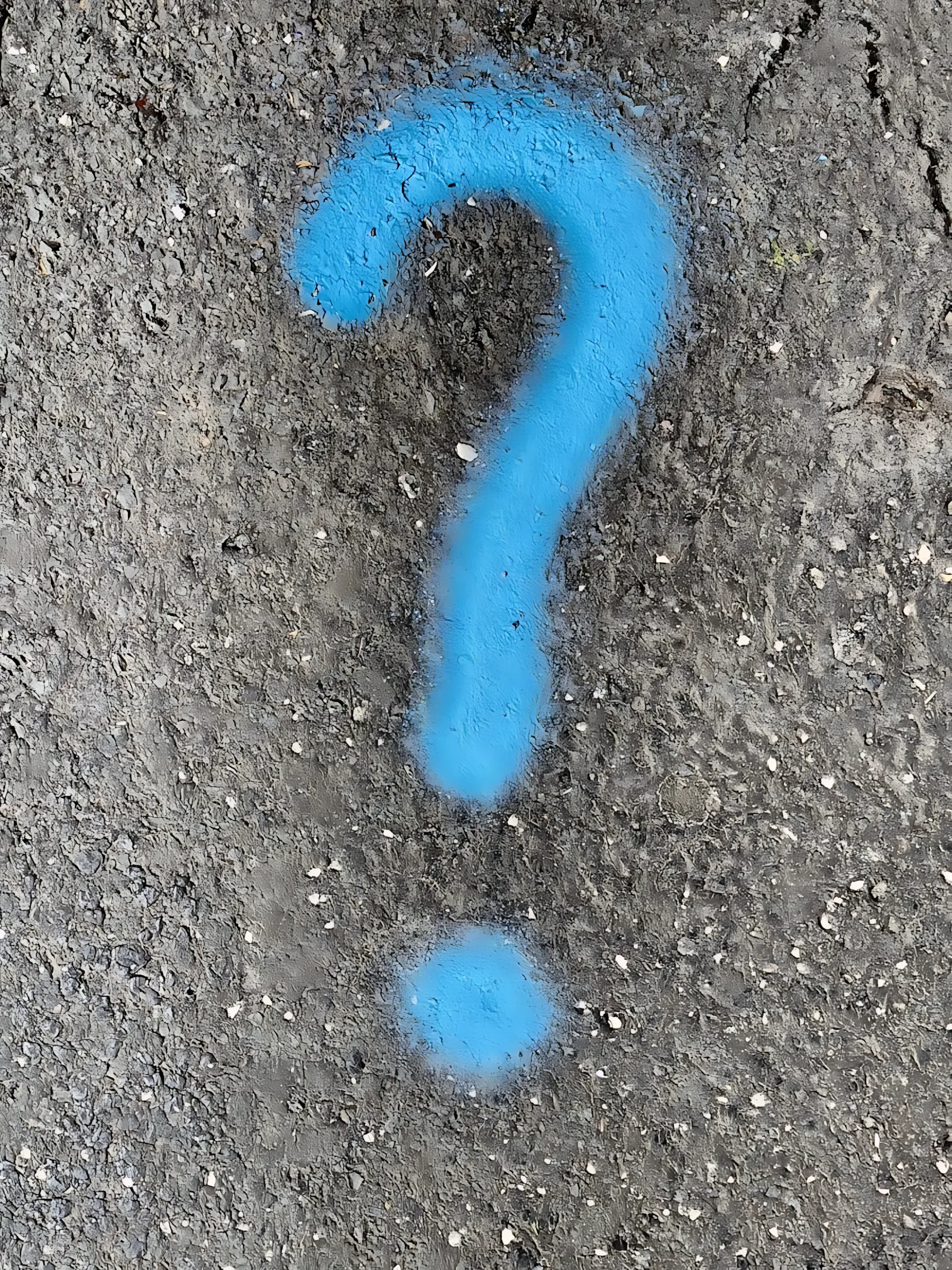 a blue question mark painted on the ground