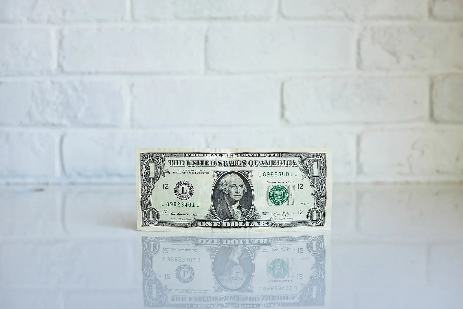 1 U. S. dollar banknote on white surface