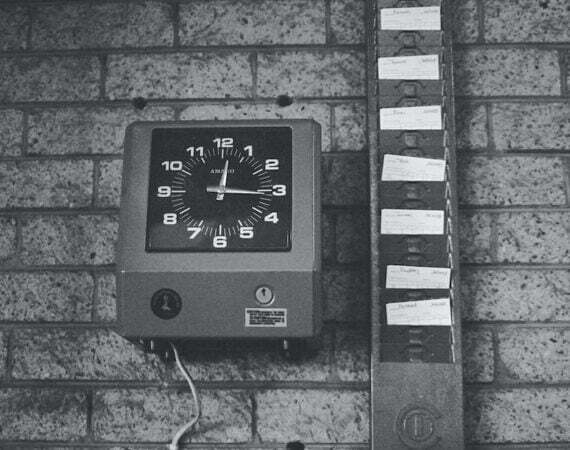 black and white analog wall clock at 10 00
