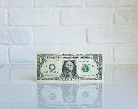 1 U.S. dollar banknote on white surface