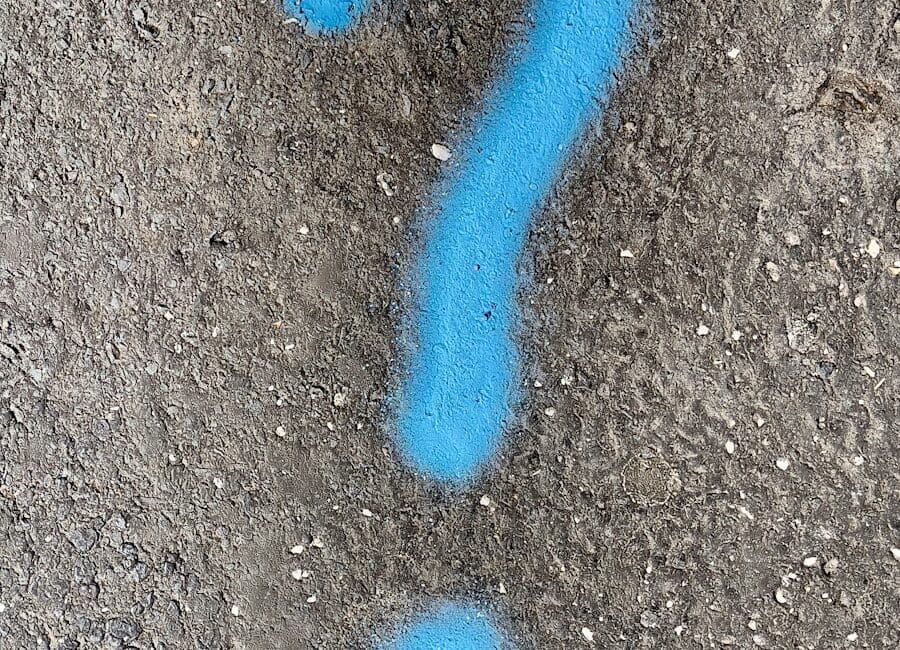 a blue question mark painted on the ground