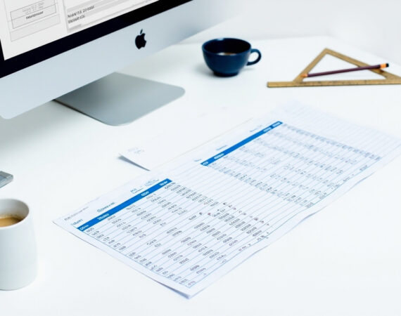 Construction cost estimate spreadsheet on a desk